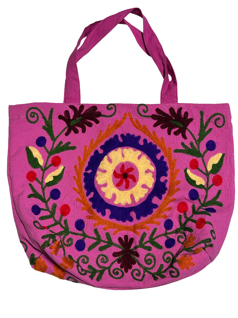 Suzani canvas beach bag with embroidery in pink, navy blue, black and green, front view