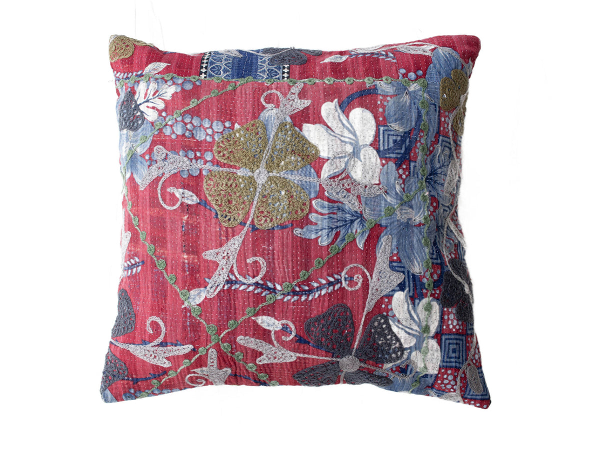 Red suzani pillowcase 50x50 cm with colorful Indian ethnic embroidery in blue beige white and green creepers in vintage boho style.